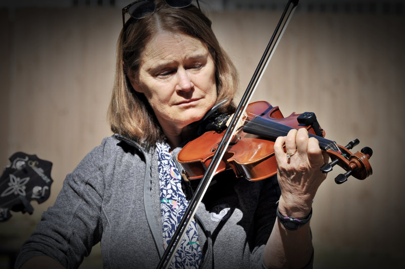Woman playing fiddle at the Fiddlers Convention