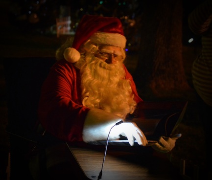 Santa reading the Night Before Christmas at the North Pole Stroll in Athens
